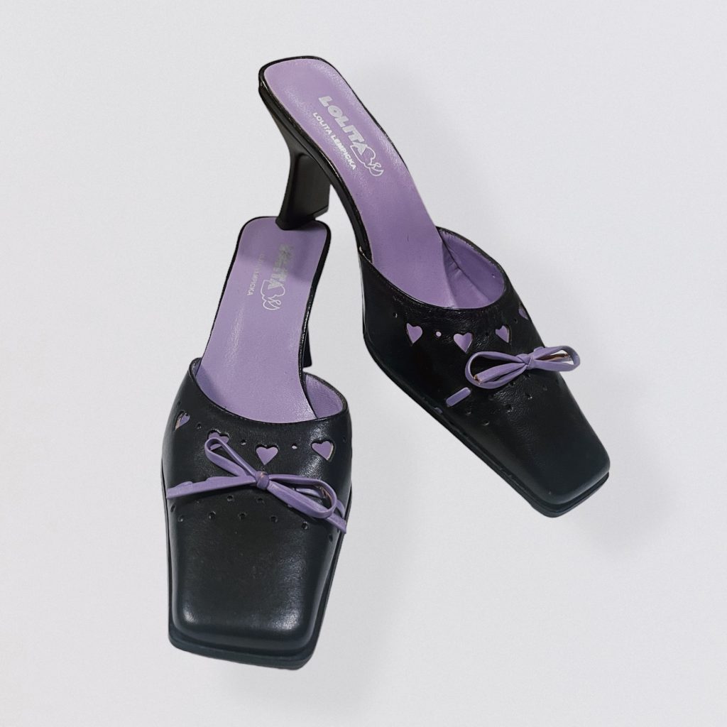 LOLITA LEMPICKA – black leather mules with square toe, heart cutouts and purple bow