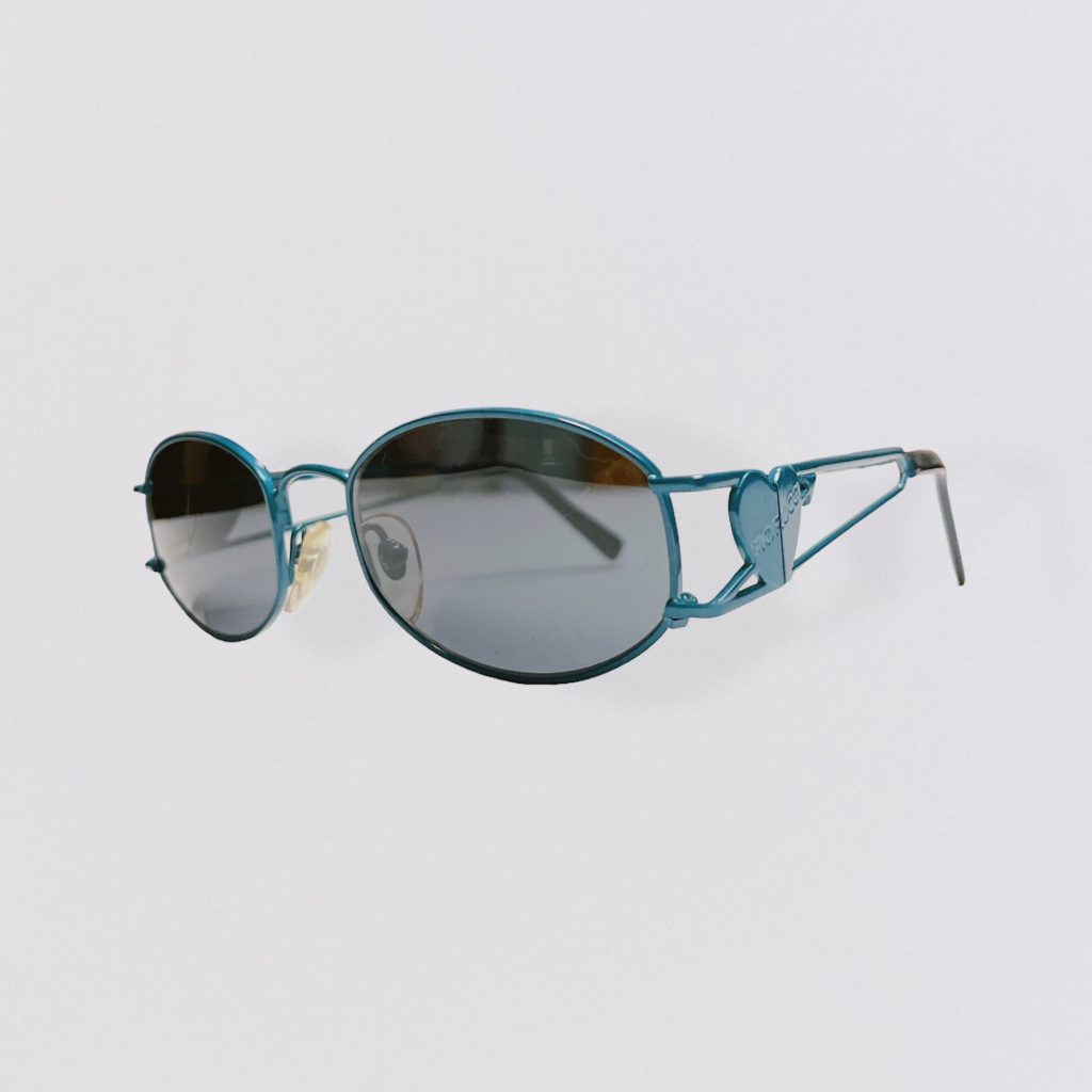 FIORUCCI – oval sunglasses with blue metal frame and heart detail