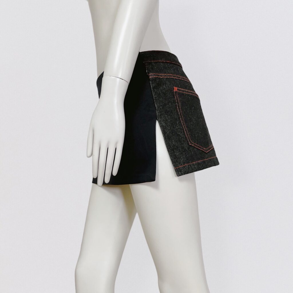 DOLCE & GABANNA – Low-waisted slit mini skirt in black satin silk and denim